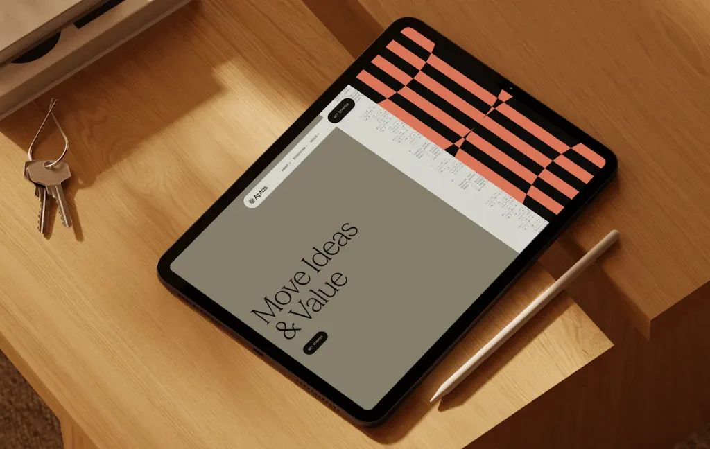 Tablet showing an Aptos editorial page in pink and black