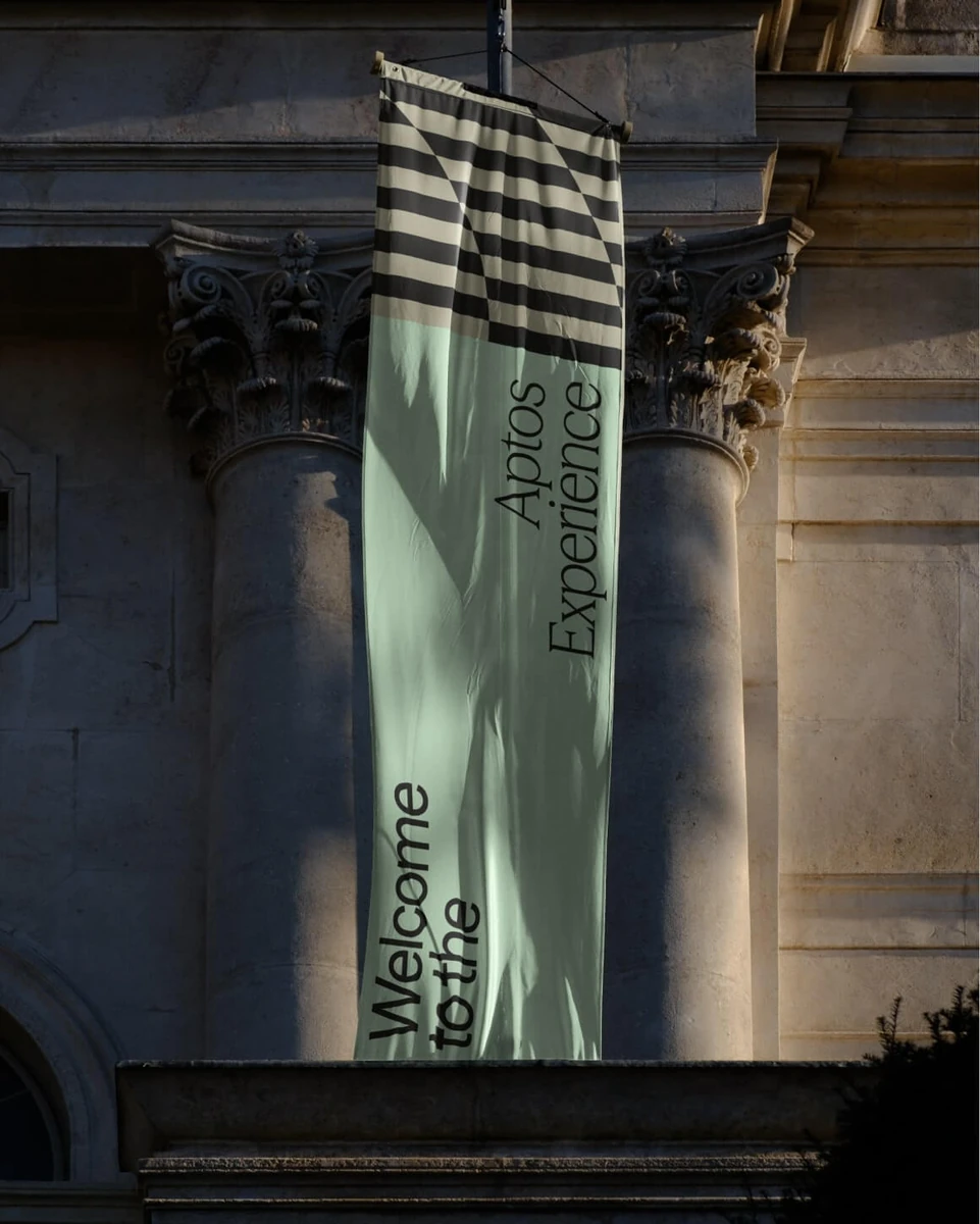 Aptos banner hanging between stone columns