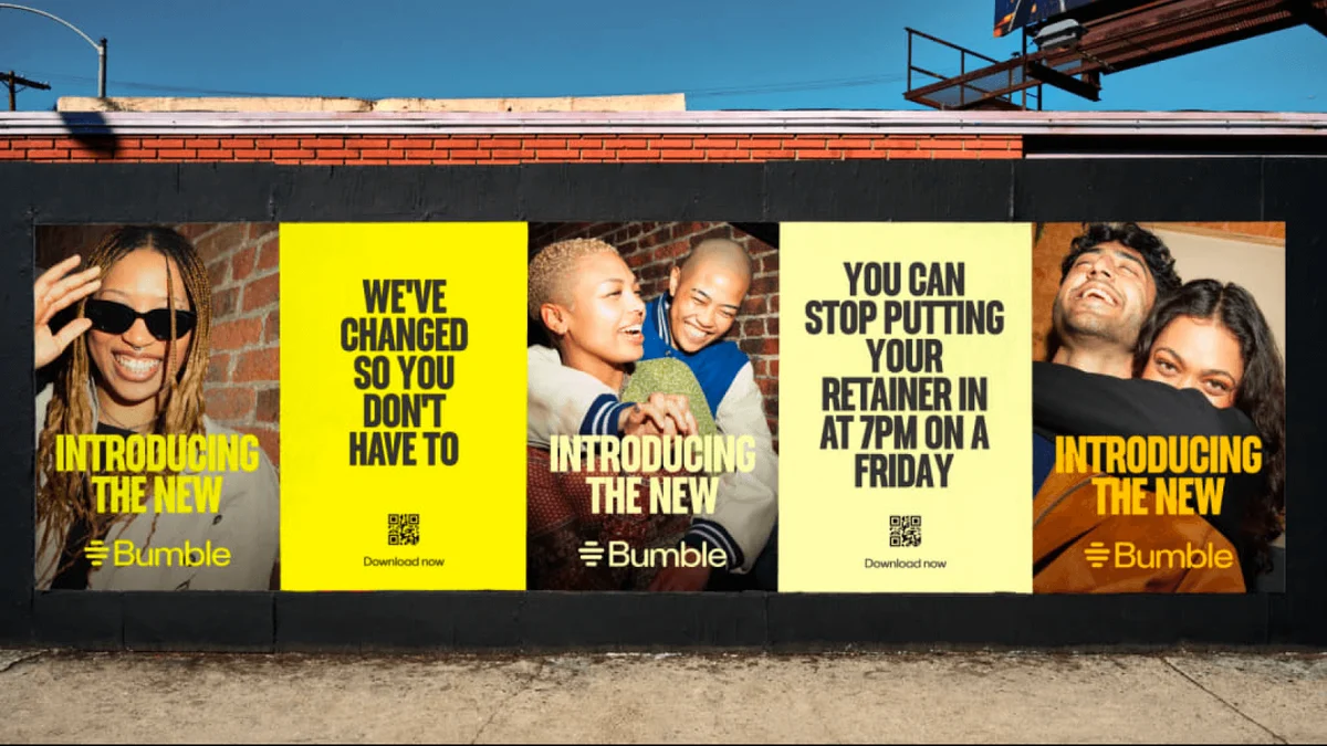 Bumble billboards on a street wall