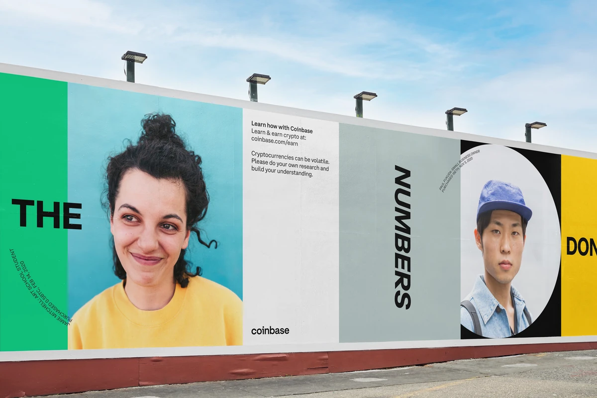 Coinbase portrait billboards on a construction wall
