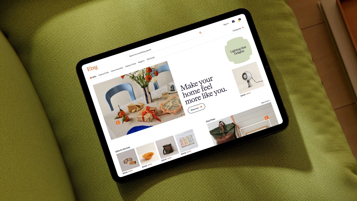 Tablet showing the Etsy website on a green cushion