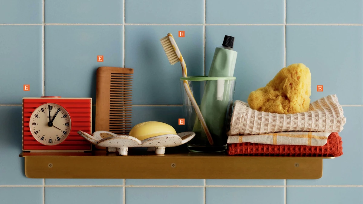 Shelf of handmade items against blue tiles, Etsy photography
