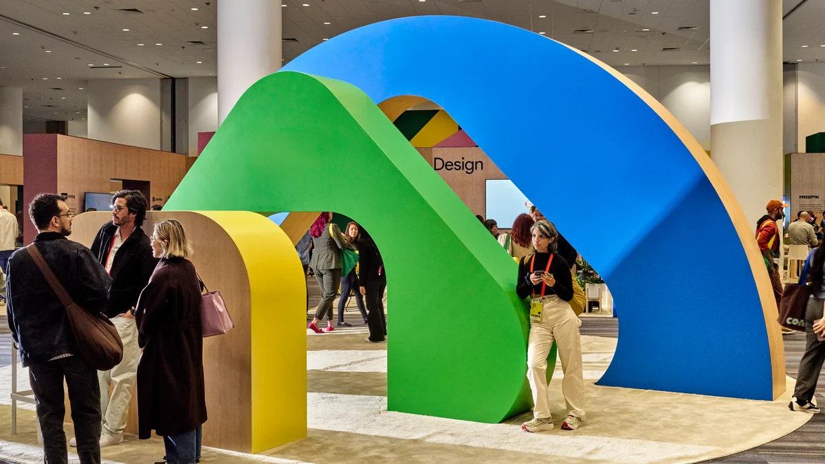 Large colourful arch sculpture at a Figma event