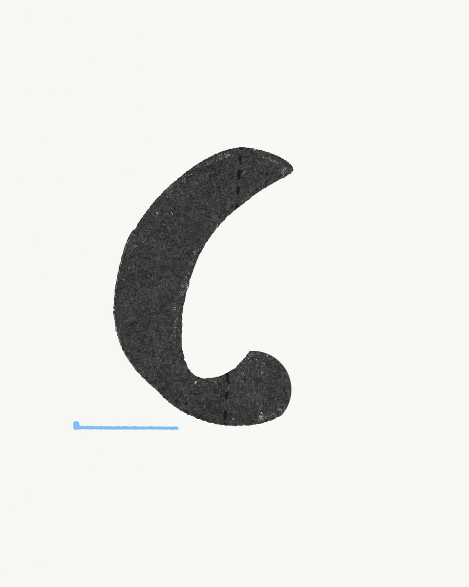 Hand-drawn black 'C'-like brushstroke on cream paper
