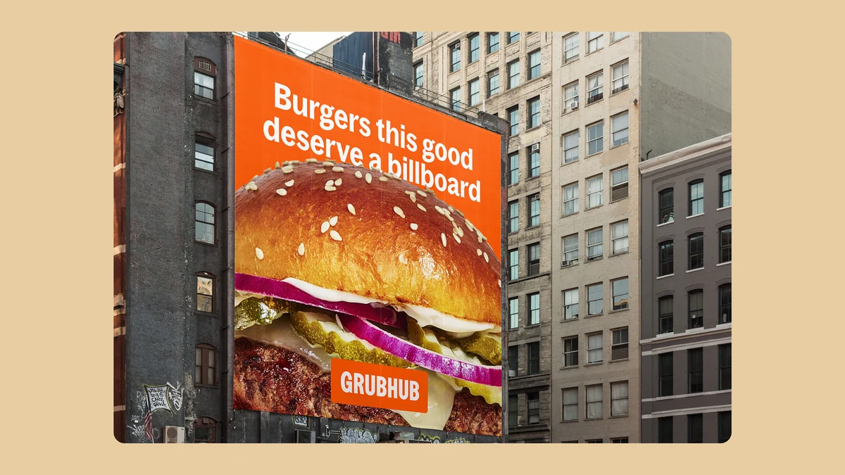 Grubhub billboard with a burger on a city building