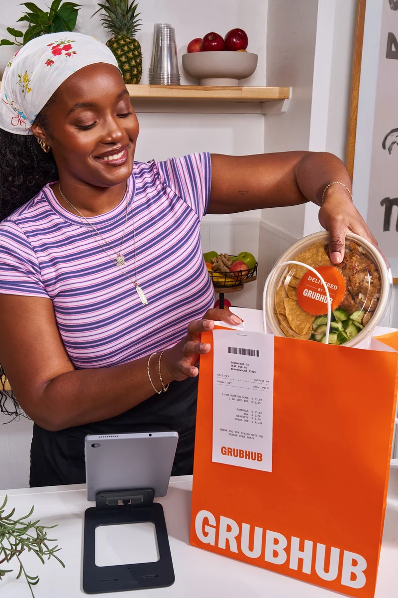 Woman holding a Grubhub bag