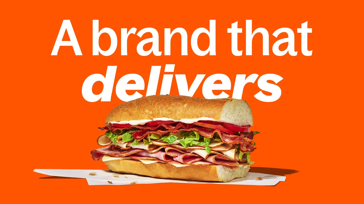 Grubhub ad: 'A brand that delivers' with a sandwich