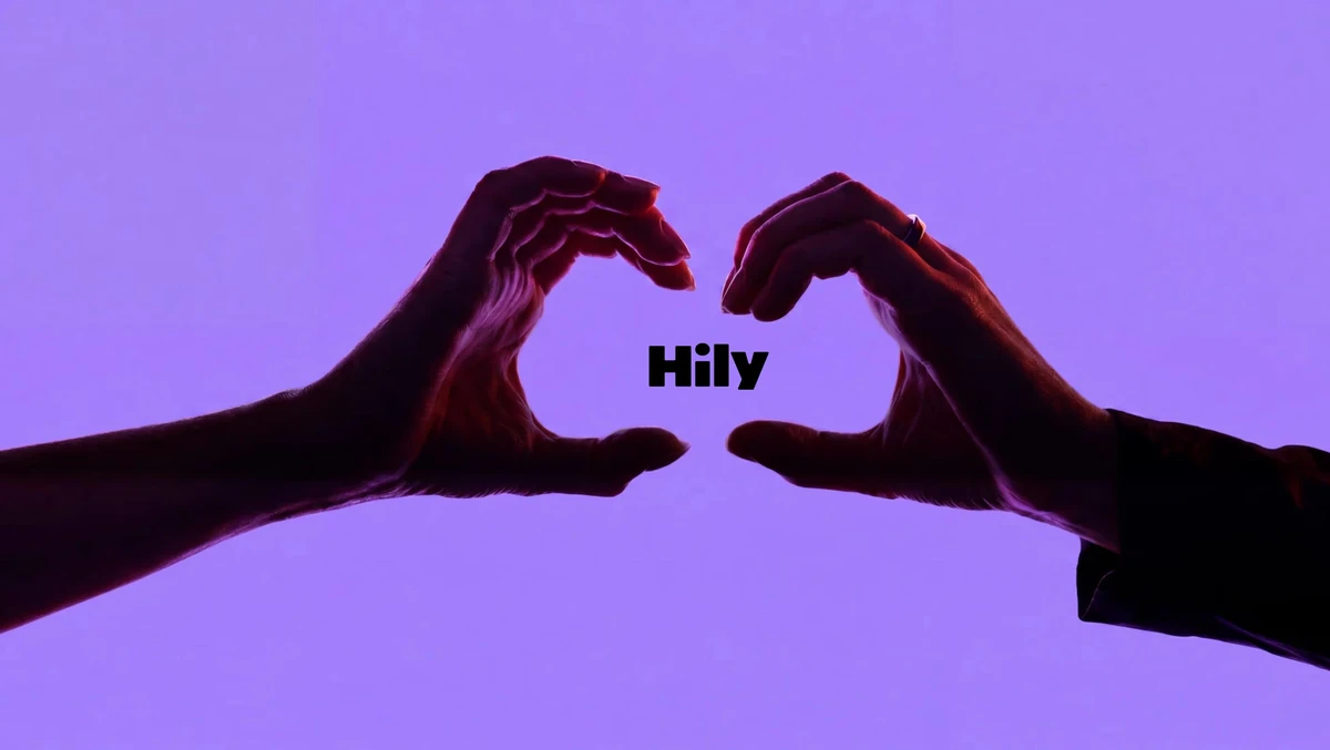 Handen die een hart vormen boven het Hily-woordmerk op paars