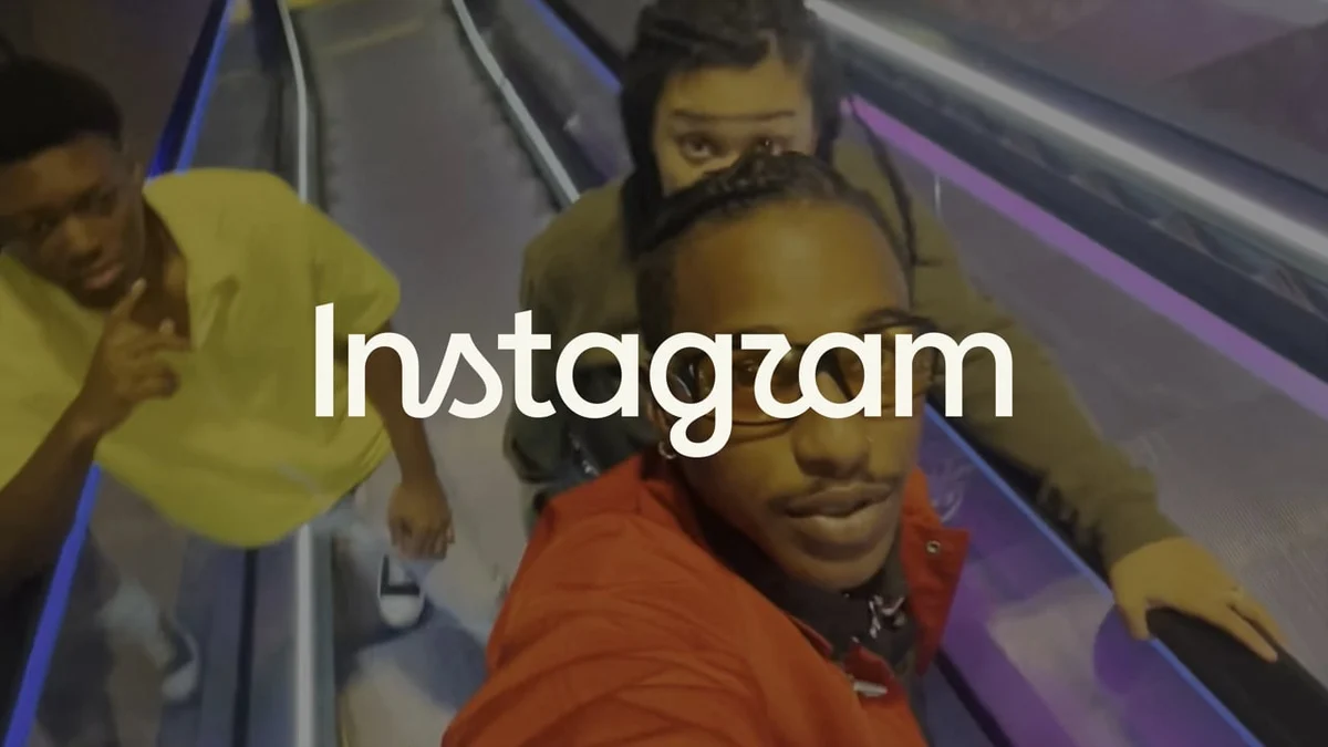 Instagram wordmark over a motion-blurred escalator scene