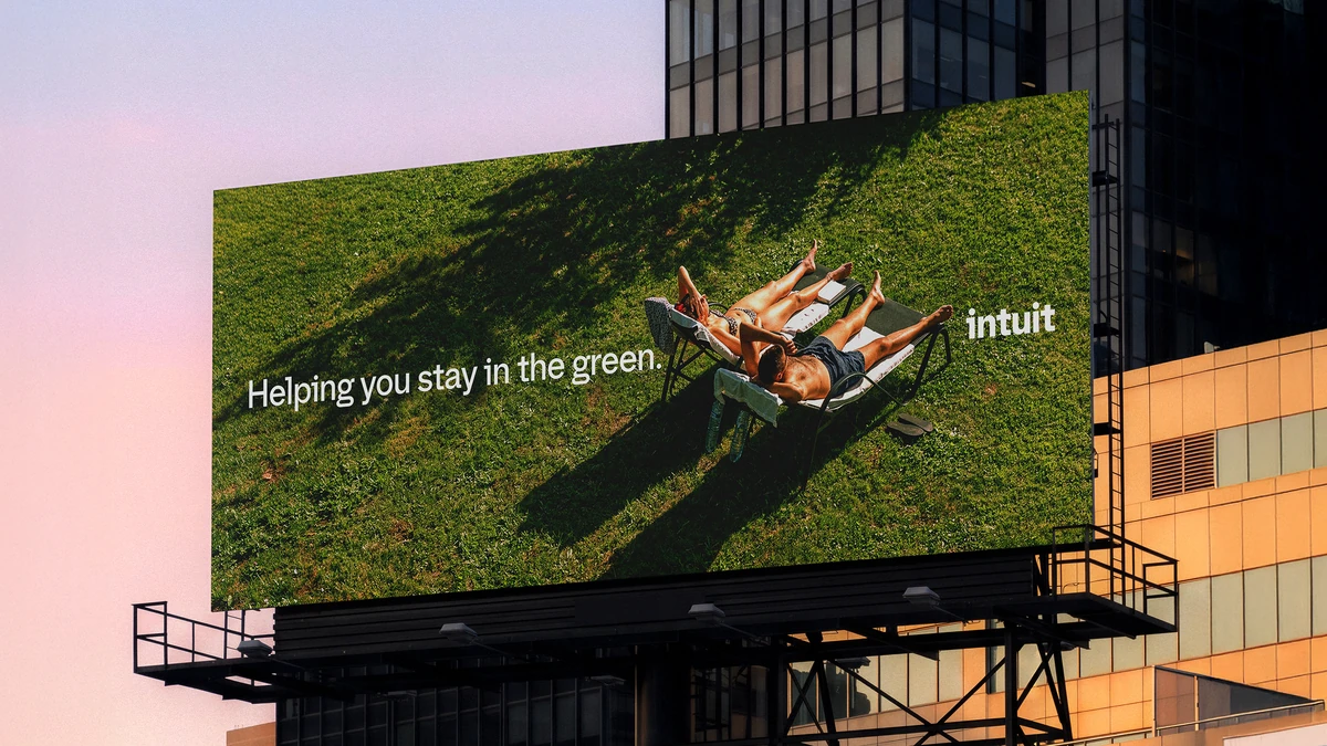 Intuit billboard over grass: 'Helping you stay in the green'