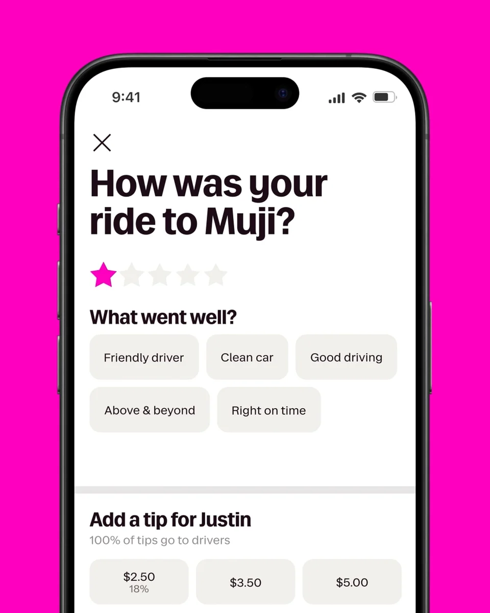Lyft app screen asking 'How was your ride to Muji?' on pink