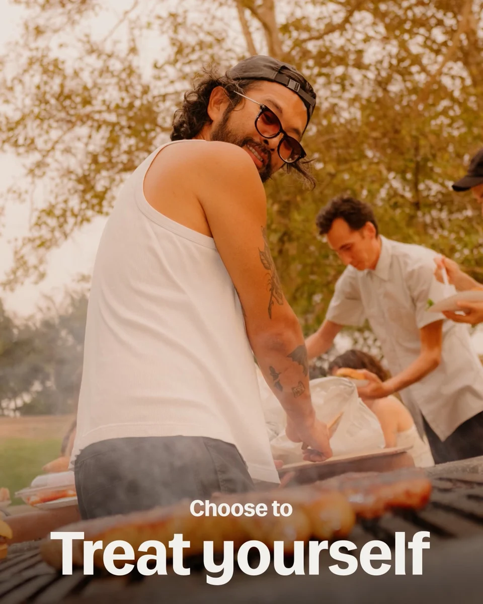 Lyft photo ad: 'Treat yourself' with a man at a beach