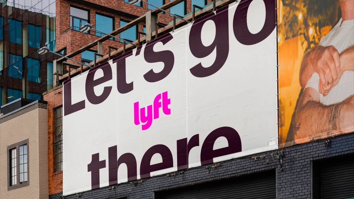 Lyft billboard on a building: 'Let's go there'