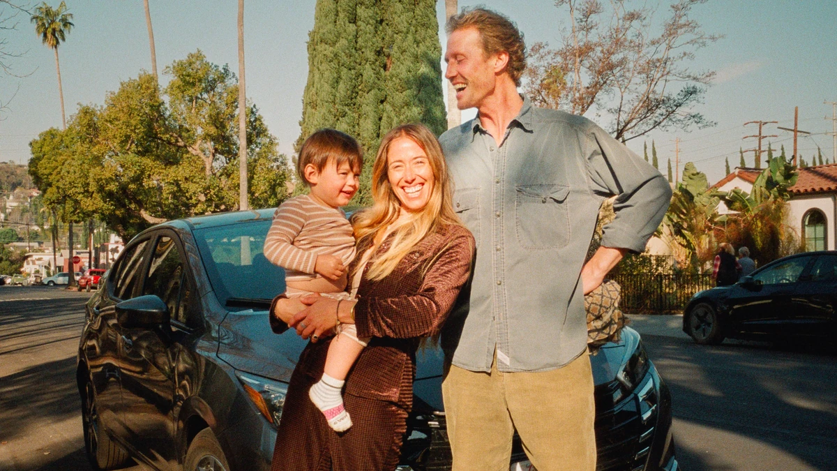 Family standing beside a car, Lyft photography