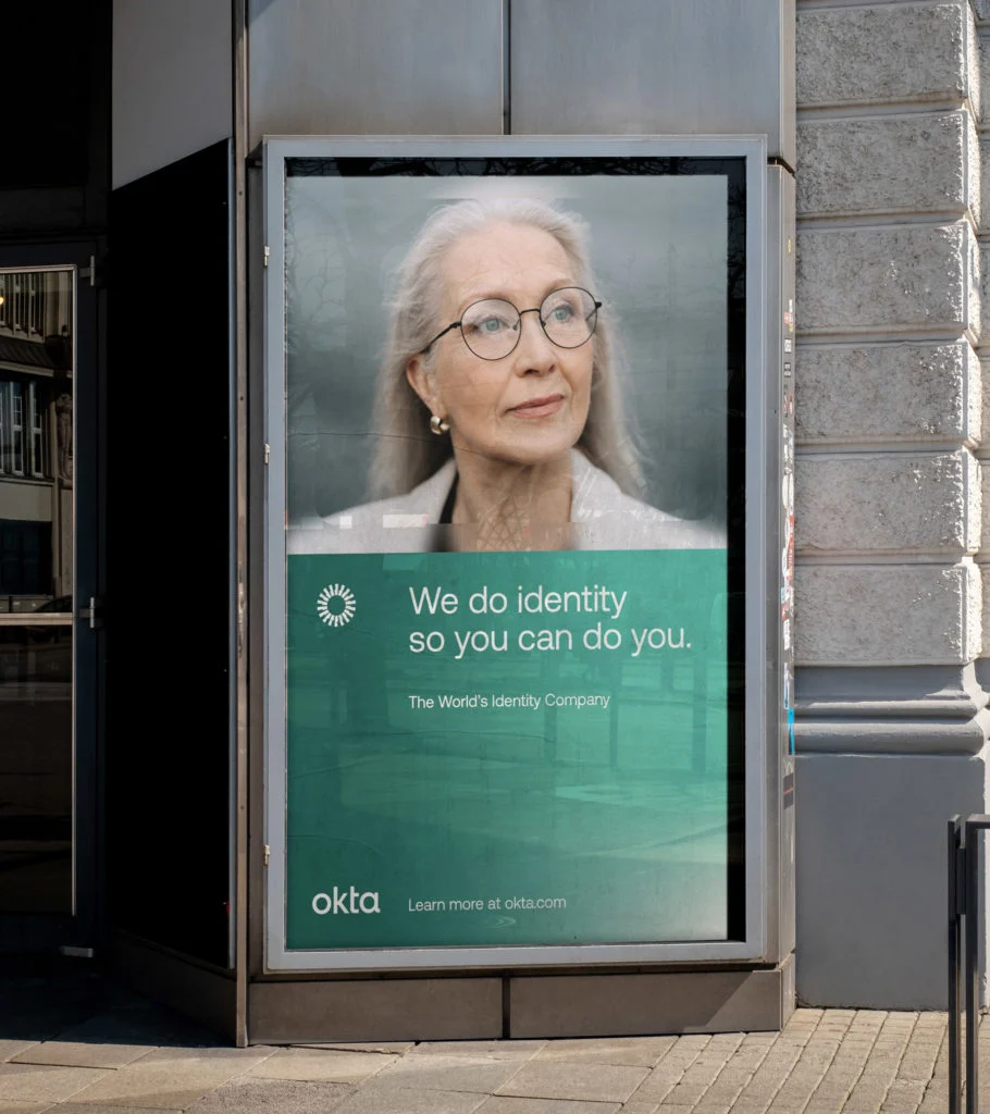 Okta poster in a bus shelter