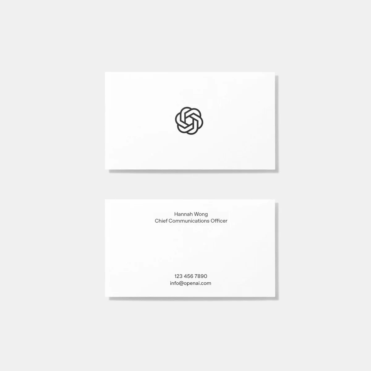 OpenAI business cards with the blossom symbol