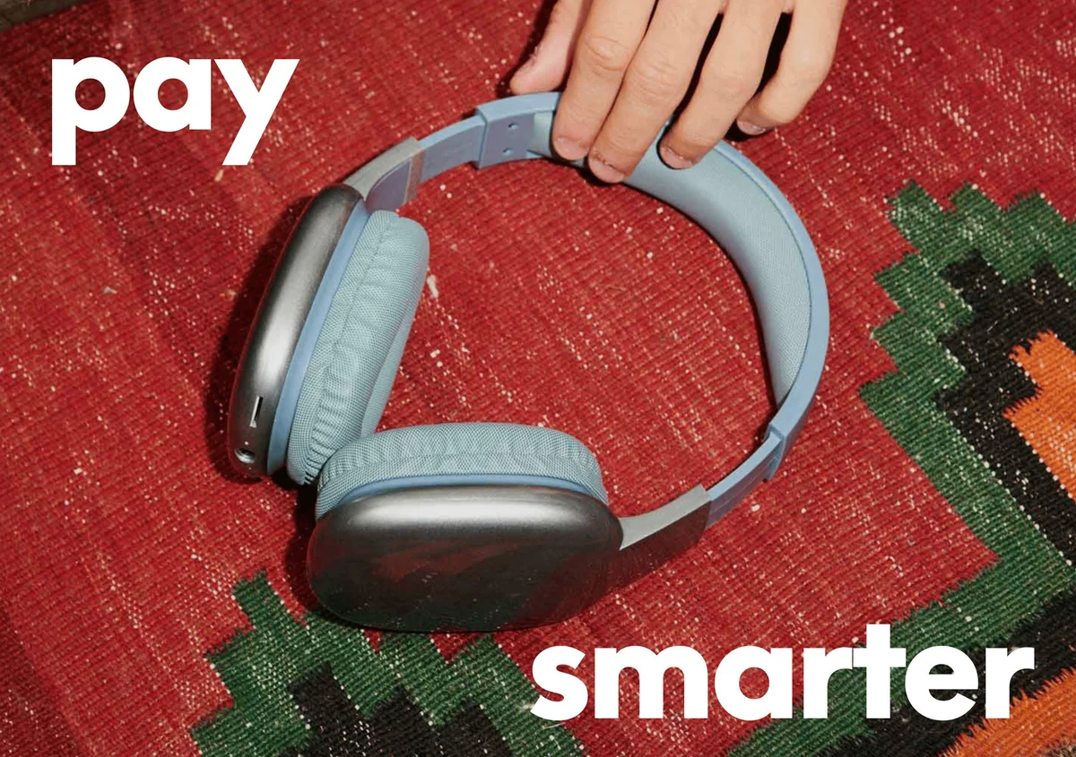 PayPal 'pay smarter' ad with headphones on a woven rug