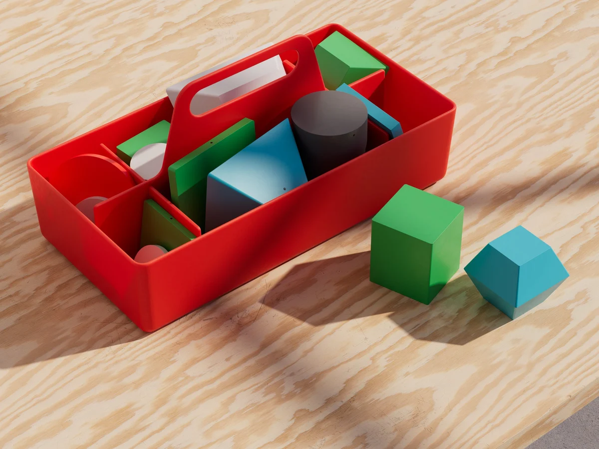Rood dienblad met Pienso-blokken vanuit een andere hoek