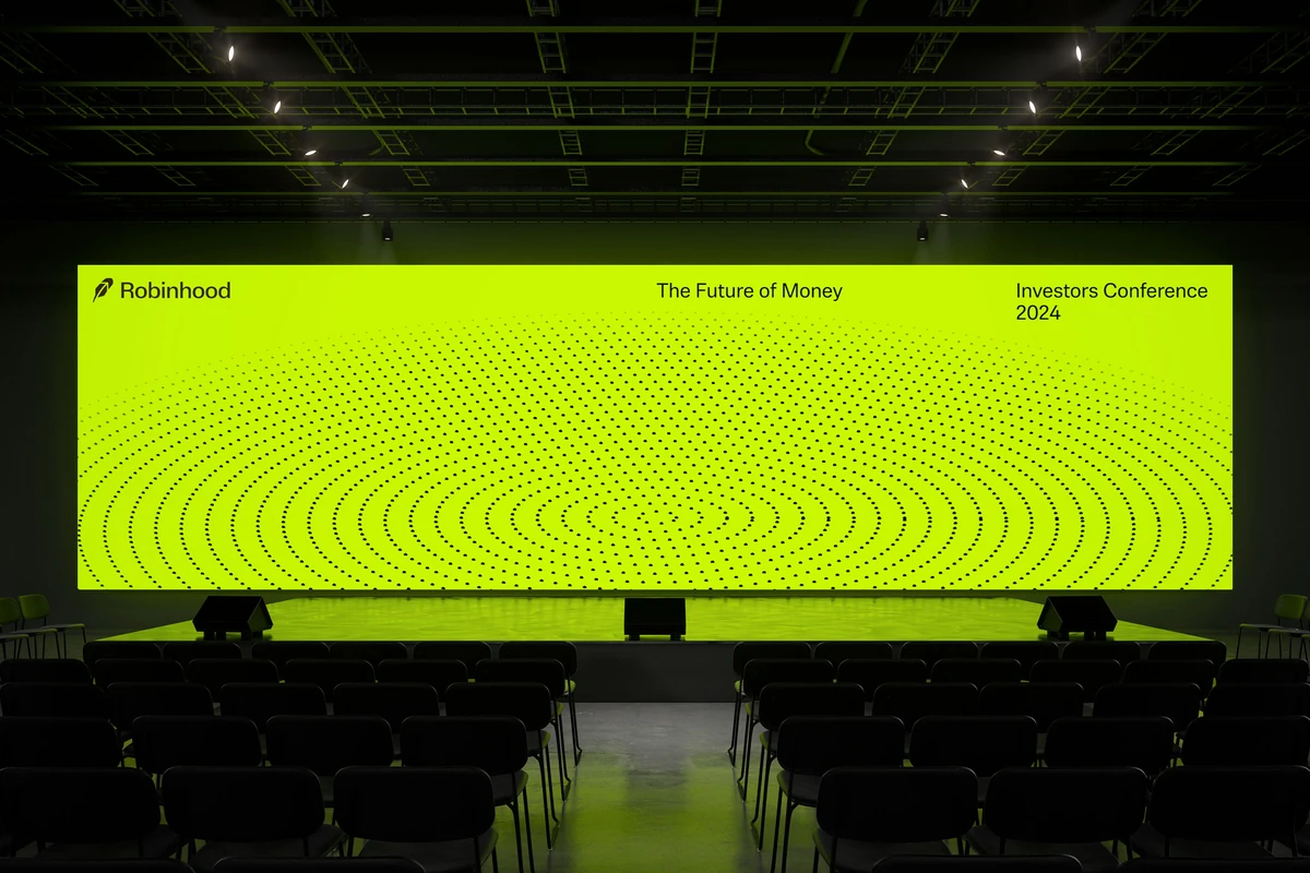 Robinhood stage with a large neon-green screen