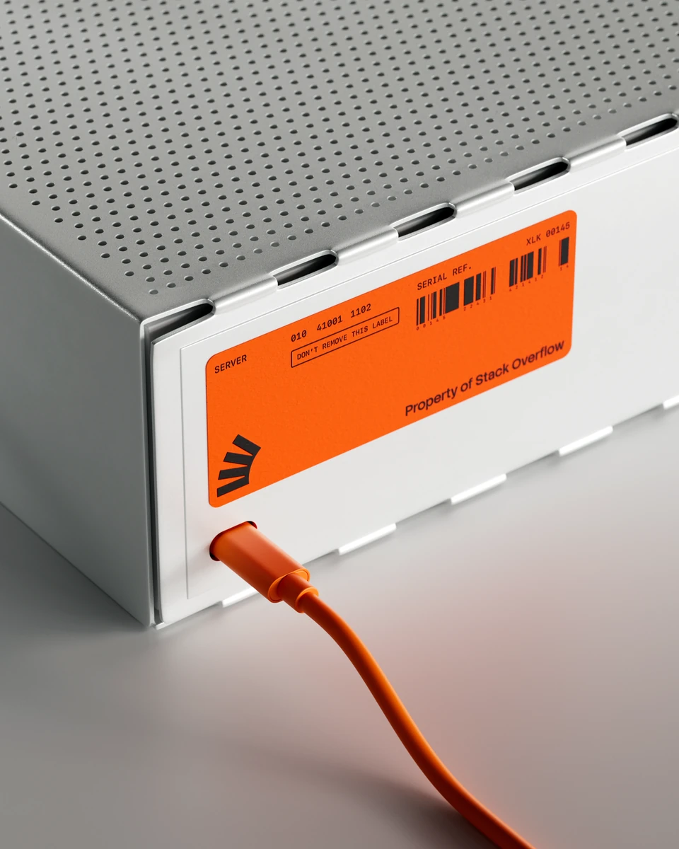 Orange Stack Overflow cable plugged into a grey device