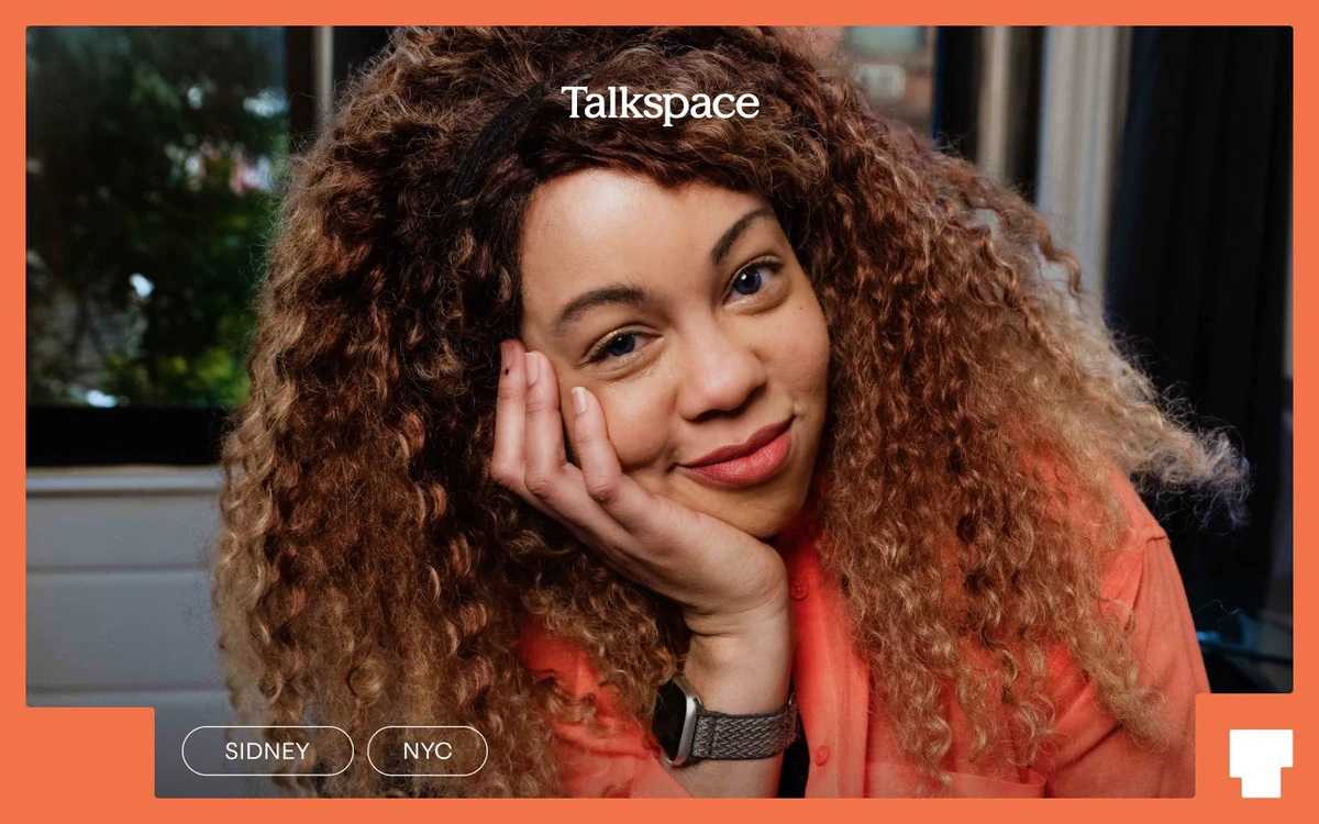 Talkspace portrait of a smiling woman with the logo