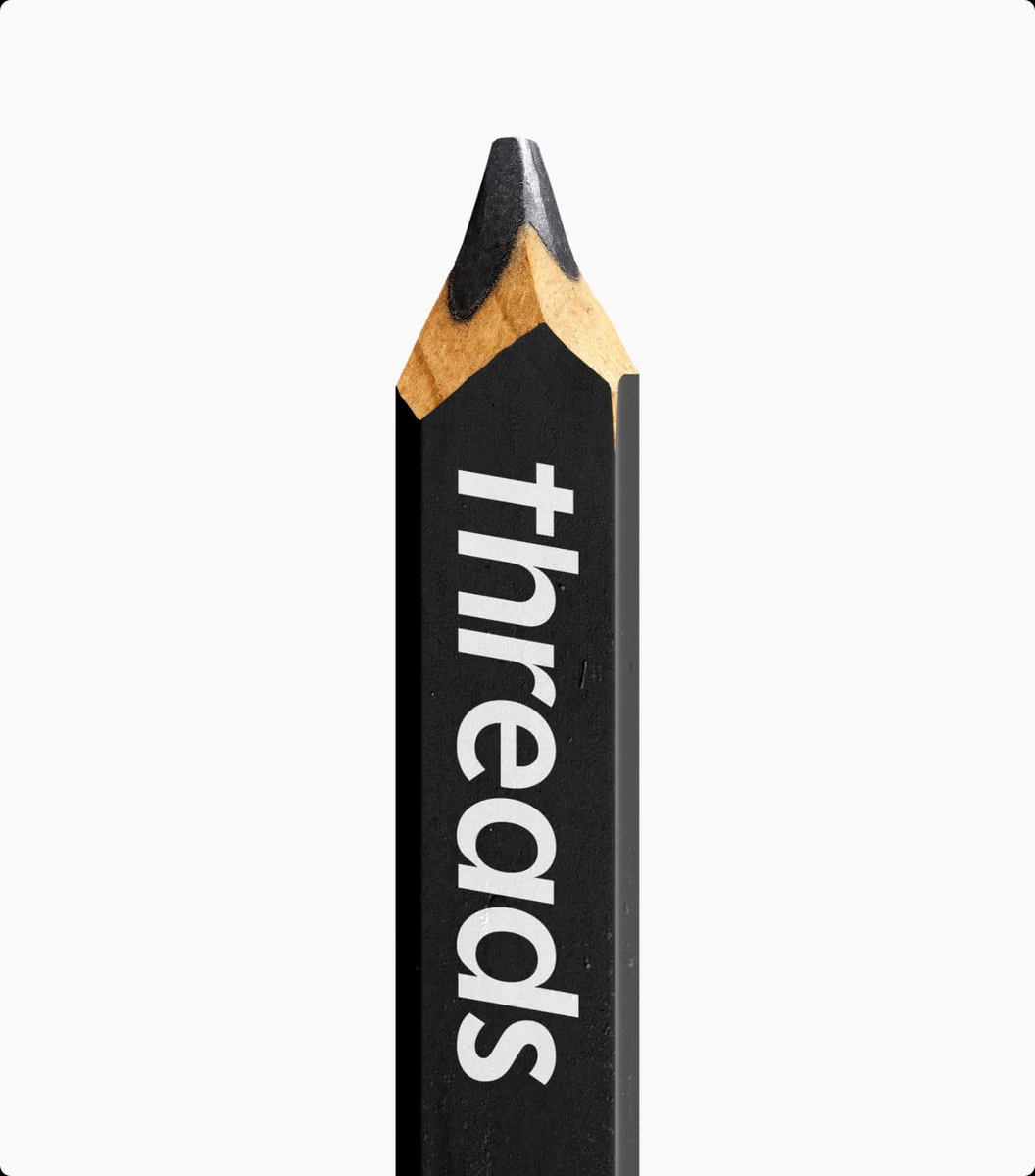 Black pencil printed with the Threads wordmark