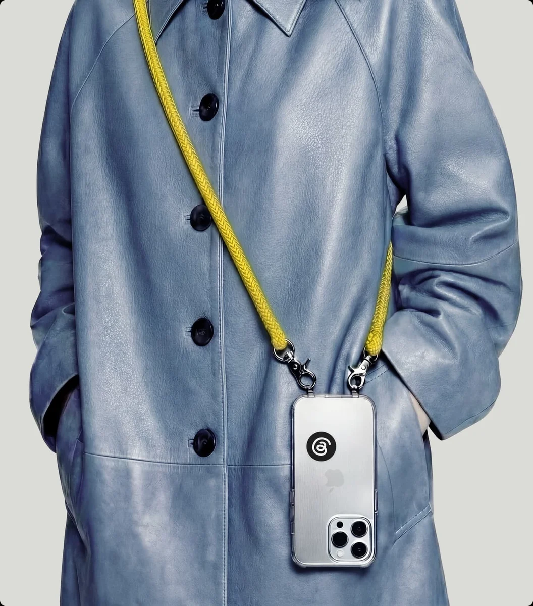 Model wearing a phone lanyard with a Threads-branded case
