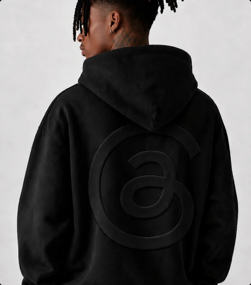 Back of a black hoodie with a tonal Threads symbol