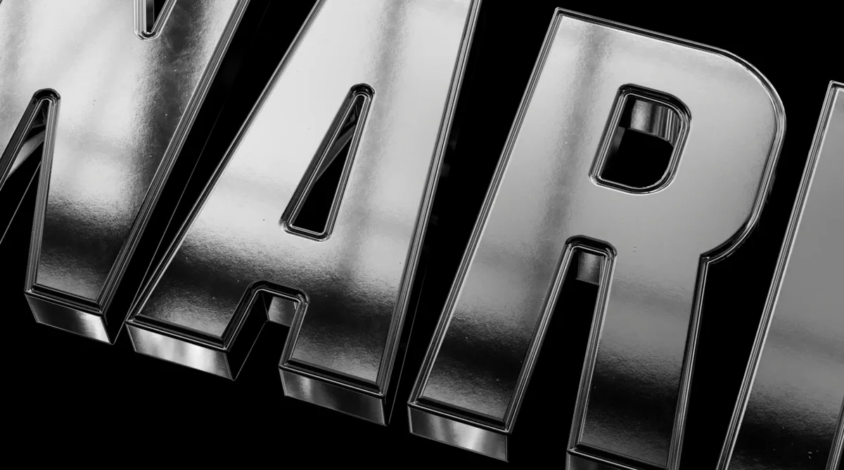 Close-up of chrome 3D letters on black