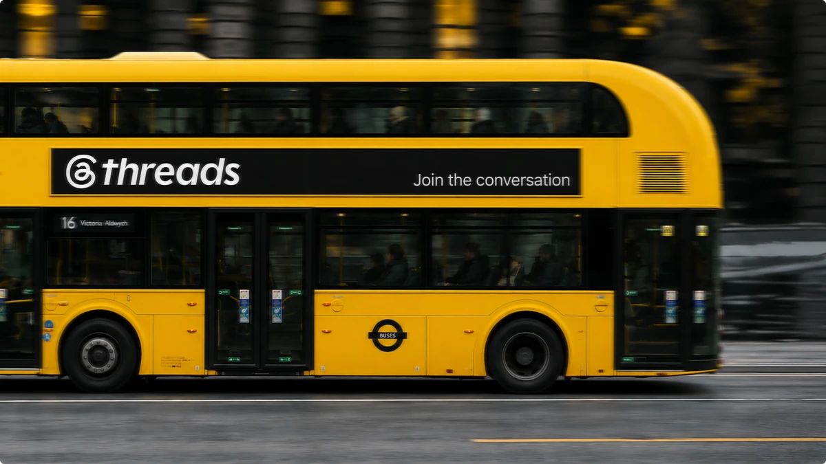 Yellow double-decker bus wrapped in a Threads ad
