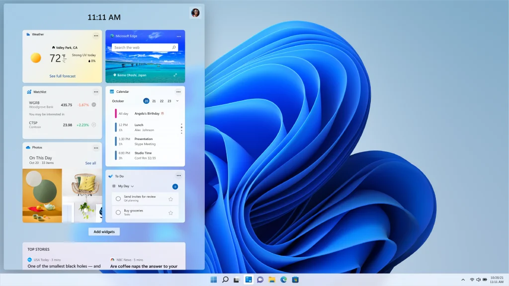 Windows 11 widgets panel over the bloom wallpaper