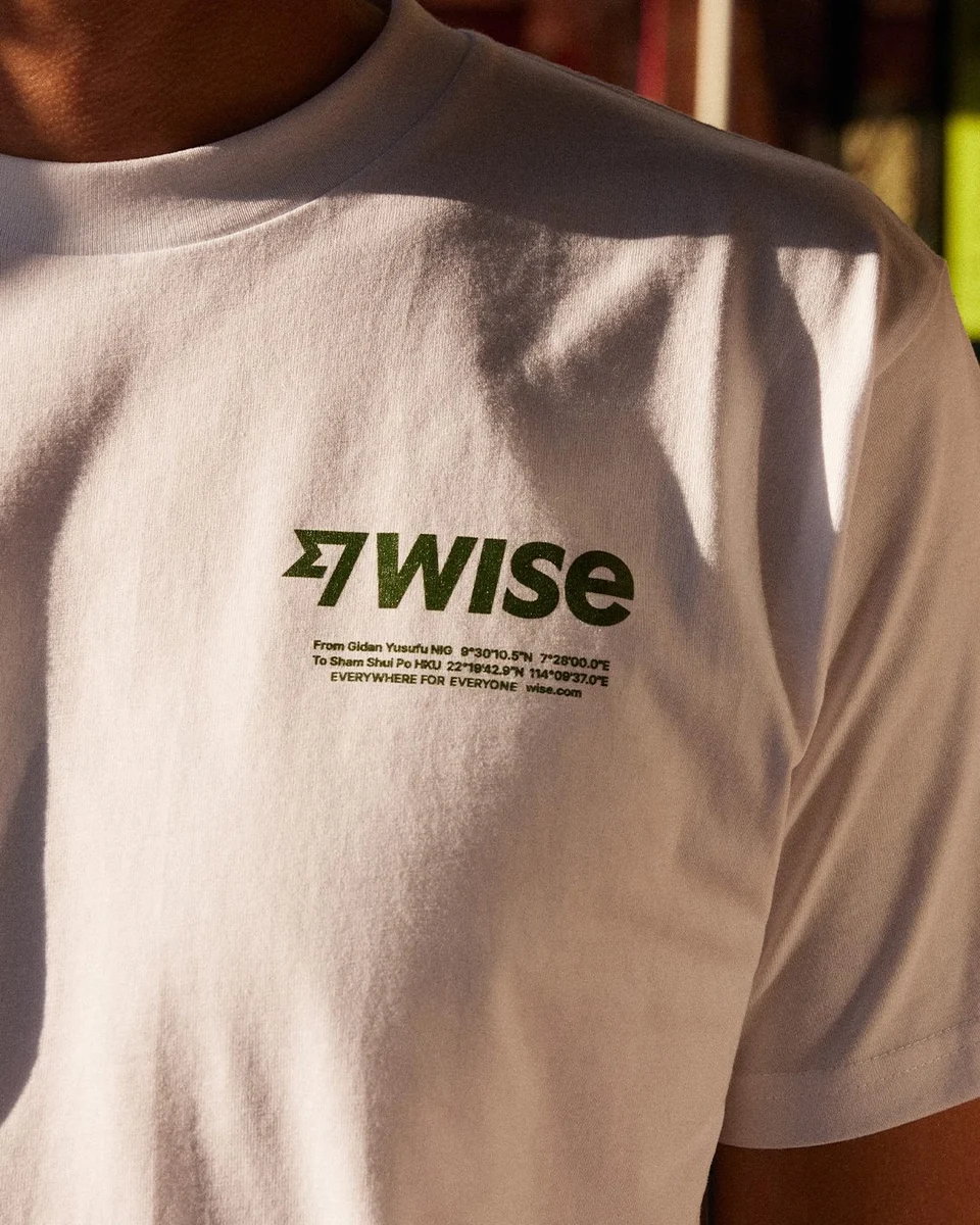 Back of a white T-shirt with the Wise logo