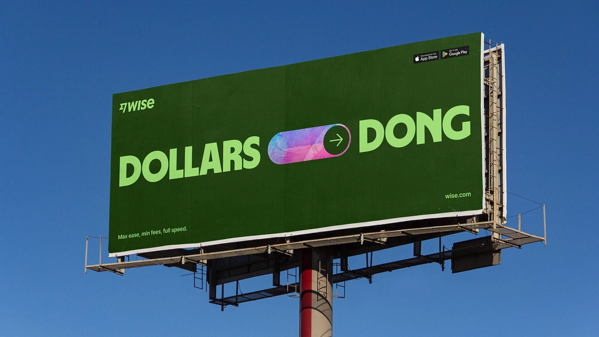 Wise billboard: 'Dollars ⇄ Dong' against a blue sky